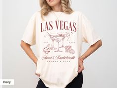 a woman standing with her hands on her hips wearing a las vegas t - shirt