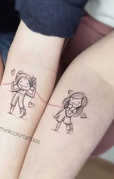 two people with matching tattoos on their arms, one holding the other's arm