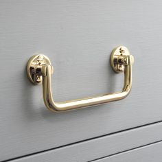 a close up of a metal handle on a drawer