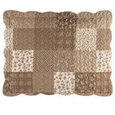 a brown and white patchwork pillow on a white background