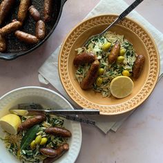 two bowls filled with food on top of a table