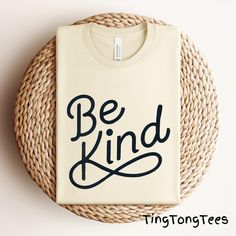 Spread positivity and kindness with this 'Be Kind' Inspirational Tee. Perfect for everyday wear, gift giving, and promoting a positive atmosphere. The unisex fit and breathable fabric make it suitable for all occasions and styles. Ideal for those looking to make a statement and choose kindness in all things. 📢 Please check all photos for details. 📢 How to Order: 1. Select your shirt size, and color from the drop-down menu. 2. Add any customization details via the "Add message to Seller" link a Be Kind Shirt, Kindness Shirt, Choose Kindness, Inspirational Tees, Spread Positivity, Motivational Gifts, Kindness Shirts, Jersey Tee, Be Kind