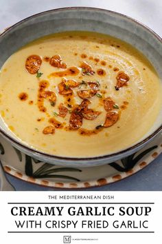 creamy garlic soup with crispy fried garlic in a bowl