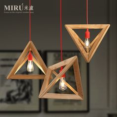 three wooden lights hanging from the ceiling