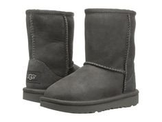 NEW TODDLER UGG BOOT CLASSIC II SUEDE COLOR: GREY SKU # 1017703T SIZES 9 - 11 ALL OUR SHOES ARE 100% AUTHENTIC IN THE ORIGINAL BOX WITH THE TAG OR MONEY BACK DESCRIPTION Keep things cute and cozy all season long with the UGG Kids Classic II boot. This product was made in a factory that supports women in the UGG supply chain with the help of HERproject, a collaborative initiative that creates partnerships with brands like UGG to empower and educate women in the workplace. Signature Twinface upper with a round toe. UGG® signature Twinface sheepskin is treated on both sides to provide maximum softness and comfort. Durable nylon binding with whipstitch details. Easy pull-on style. Pretreated uppers to repel water and stains. Foam cushioned footbed is lined with UGGpure™ wool for warmth and com Y2k Png, Grey Ugg, Boots Y2k, Grey Ugg Boots, Uggs For Cheap, Ugg Boots Outlets, Ugg Kids, Womens Black Booties, Ugg Style