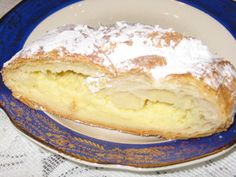 a pastry sitting on top of a blue and white plate