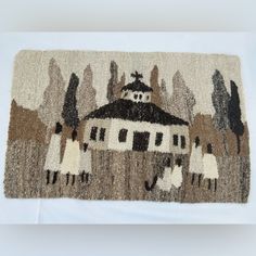 a rug with an image of a house on it