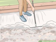 a person standing on the ground with a shovel in their hand and sand behind them