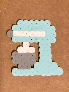 the letter e is made out of foam and has sheeps on it's side