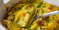 a casserole dish with broccoli and cheese in it is ready to be eaten