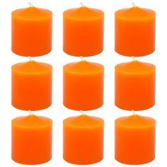 six orange candles are lined up in rows