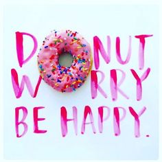 a donut with sprinkles on it and the words donut worry be happy