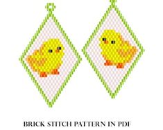 a pair of cross stitch earrings with a yellow duck