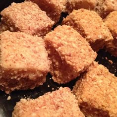 cubes of food sitting in a frying pan