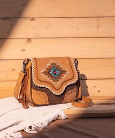 Discover the Montana West Aztec Fringe Crossbody Purse, a stylish Western bag perfect for any occasion. Featuring intricate Aztec embroidery and fringe detailing, this shoulder bag offers a spacious interior and high-quality materials. Ideal for daily use or special events, this purse embodies Western charm and functionality. Aztec Embroidery, Fringe Crossbody Purse, Western Bag, Front Fringe, Fringe Crossbody Bag, Western Purses, Aztec Pattern, Crossbody Tote, Leather Journal