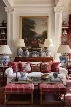 a living room filled with lots of furniture and lamps on top of it's tables