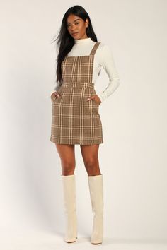 You'll be reaching for the Lulus Plaid to Be Yours Beige and Brown Plaid Pinafore Mini Dress all season long like it was made just for you! Brushed, wool-inspired woven fabric, with a brown and ivory plaid atop a beige background, shapes this cute pinafore dress that has a square neckline, an apron-style bodice, and wide straps that secure with hidden buttons at the back. A banded waist tops an A-line mini skirt with diagonal front pockets. Hidden zipper/clasp at back. Fit: This garment fits tru Plaid Dress Outfit, Winter Club Outfits, Plaid Overall Dress, Club Outfits For Women, Fall Dress Outfit, Flannel Dress, Lulu Fashion, A Line Mini Skirt, Pinafore Dress