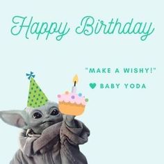 a baby yoda is holding a birthday cake