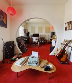 a living room filled with furniture and musical instruments