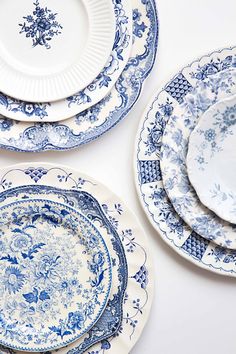 blue and white plates stacked on top of each other