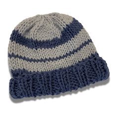 a blue and white knitted hat on a white background with clipping to the side