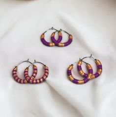 Show your team spirit and represent your game day team colors with these stunning purple and metallic gold heishi bead stainless steel hoop earrings.  - Available in 2 sizes: 1" and 1.5" - Three unique designs to choose from Make a statement and cheer on your team in style with these trendy earrings. Perfect for game day or any occasion. Grab a pair now and show your support! Adjustable Small Purple Hoop Earrings, Adjustable Nickel-free Purple Hoop Earrings, Nickel-free Purple Hoop Earrings, Handmade Purple Heishi Beads Jewelry, Beaufort Nc, Spirit Game, Bead Hoop Earrings, Purple Metallic, Team Mom