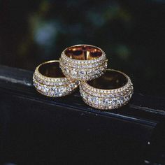 GLD's 5 Layer Diamond Band Ring is flooded in hand-placed stones. Each layer draws attention to its larger center stones, making it the perfect complimentary piece to any of our iced out products. The ring is made up of 100% precious metals made from 925 Silver covered in 3 microns of 18k gold. This product is guaranteed for life – GLD will repair or replace the item should you experience any defects in craftsmanship or breakage. Don't know your ring size? Review our sizing chart below to find y One Kiss, Cross Earrings Studs, Expensive Jewelry Luxury, Diamond Band Ring, Gold Chains For Men, Cross Chain, Vs Diamond, Jewelry Luxury, Expensive Jewelry