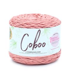 pink yarn with the word cobo written on it in white and black lettering,