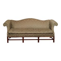 a couch that is sitting on top of a wooden frame with an upholstered back