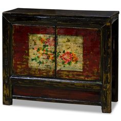 an old wooden cabinet with flowers painted on the front and side panels, all in different colors