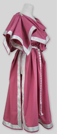 a pink robe with silver trims on it