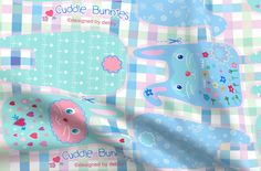 a blue and pink checkered fabric with bunny bunnies on it's sides