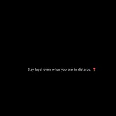 the words stay loyal even when you are in distance on a black background with red dots