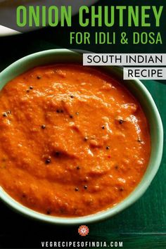 a bowl filled with red sauce on top of a green table