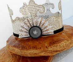 a close up of a crown on top of a piece of bread with sheet music