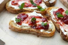 several pieces of bread with cheese and jelly on them