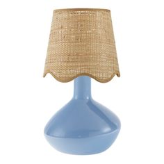 a blue table lamp with a burlap shade on the top, and a light blue base