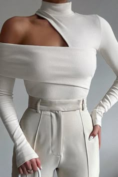 This Cold Shoulder Mockneck Top is an asymmetrical ribbed knit of sheer elegance. Showcasing spine-tingling cold shoulder reveals, it exudes classic sophistication and modern flair, making it the perfect choice for a night out. Make sure to slip it on and enjoy the refined luxury of a date night. True To Size Fits Clothes, Winter Trends, Long Sleeve Knit Tops, Long Sleeve Knit, High Collar, Fashion Tops, White Top, Knitted Pullover, Look Fashion