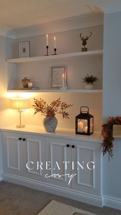 a living room filled with lots of furniture and candles on top of it's shelves