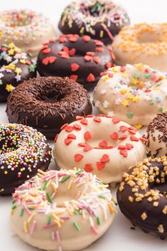 many different types of donuts with sprinkles on them