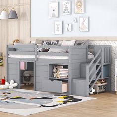 a child's bedroom with a loft bed and stairs to the second floor,