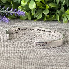 a bracelet with the words i will carry you with me, and an image of a flower