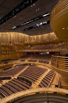 an empty concert hall with rows of seats