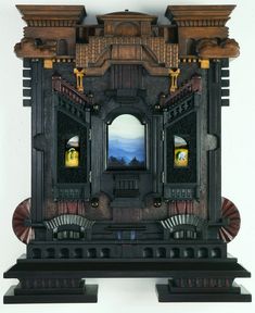 an elaborate clock with two doors on each side