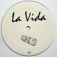 the label for la vida, which is written in black ink on a white disc