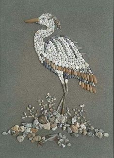 a bird made out of rocks and pebbles