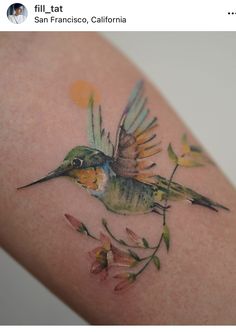 a small bird with flowers on its back