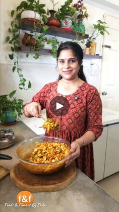 a woman standing in front of a bowl filled with food