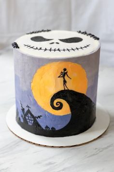 a decorated halloween cake with a skeleton on it's face and jack skellingy eyes