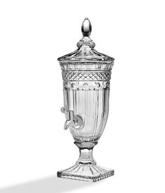 an ornate glass urn is shown against a white background